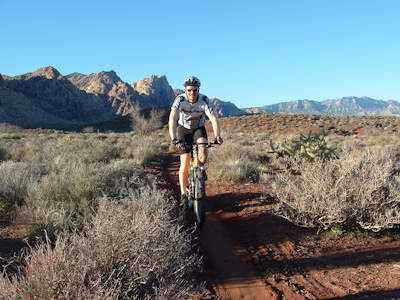 Biking in Cottonwood Valley with the Red Rock blufs in the background