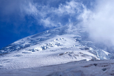 Swirling clouds on the upper slopes of Mount Rainier (14,411 feet)