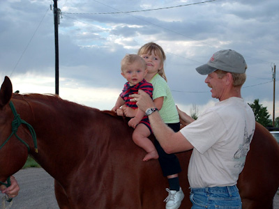 Caleb and Hannah taking their first horseback ride