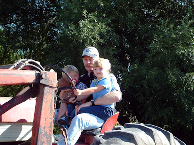 Going for a ride on uncle Dave's tractor.