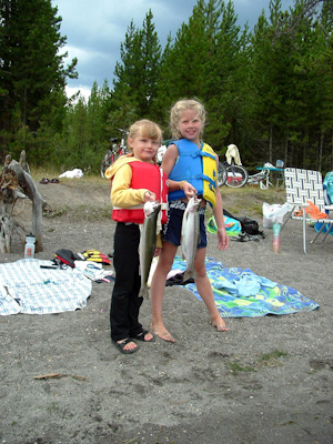 Hannah and her cousin Gina with their first catch -- 3 pound Rainbow Trout