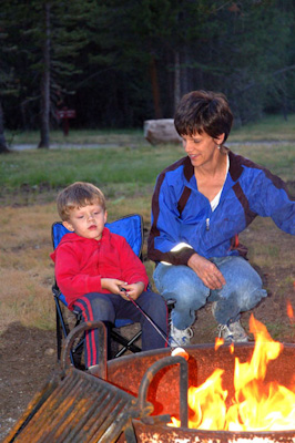 Mom and Caleb roasting marshmallows