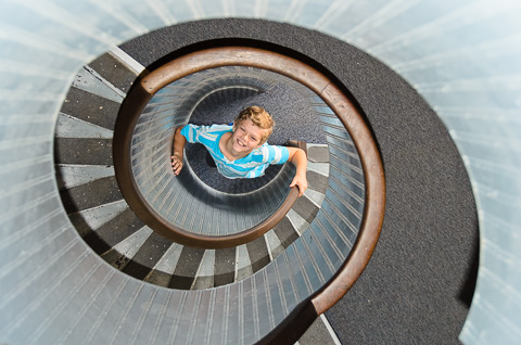 Caleb at the bottom of the spiral staircase that leads to the light in the Old Point Loma Lighthouse.